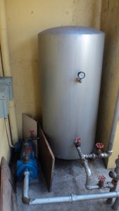 Pressure tank with water pump